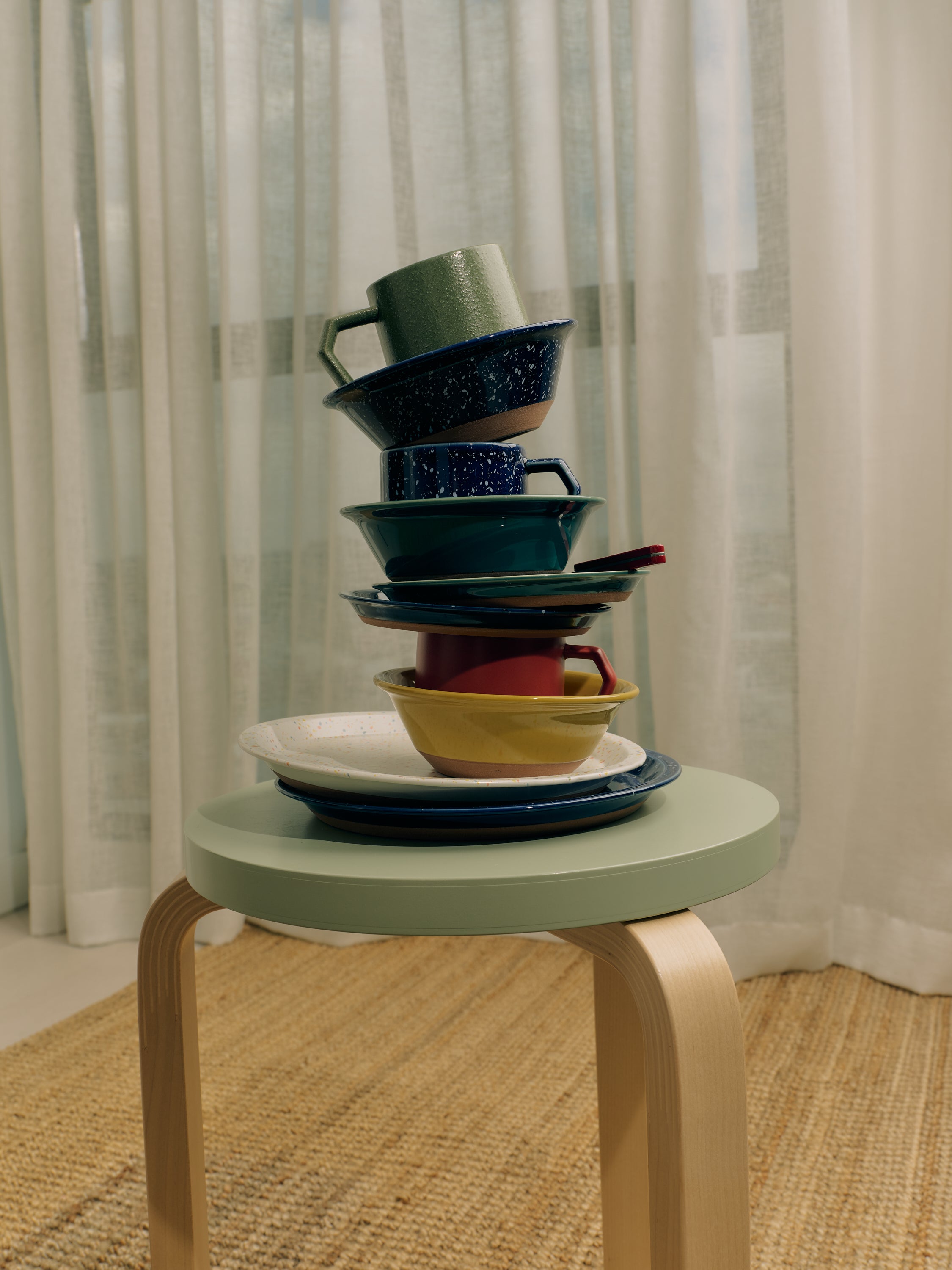 Chips mugs and tableware arranged in a lived-in home setting by JDV